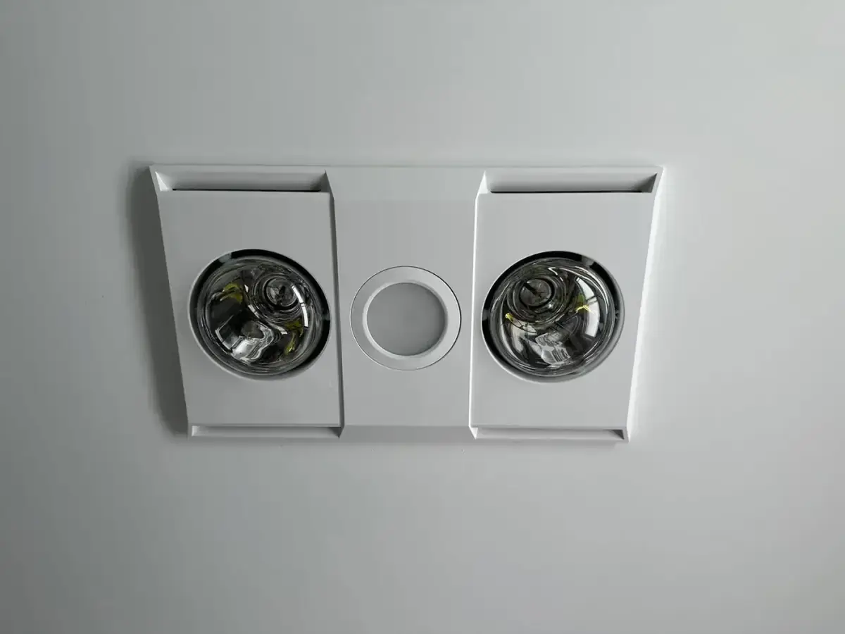 Close-up of a bathroom heat lamp, light and exhaust fan unit installed by Electrikell Qld
