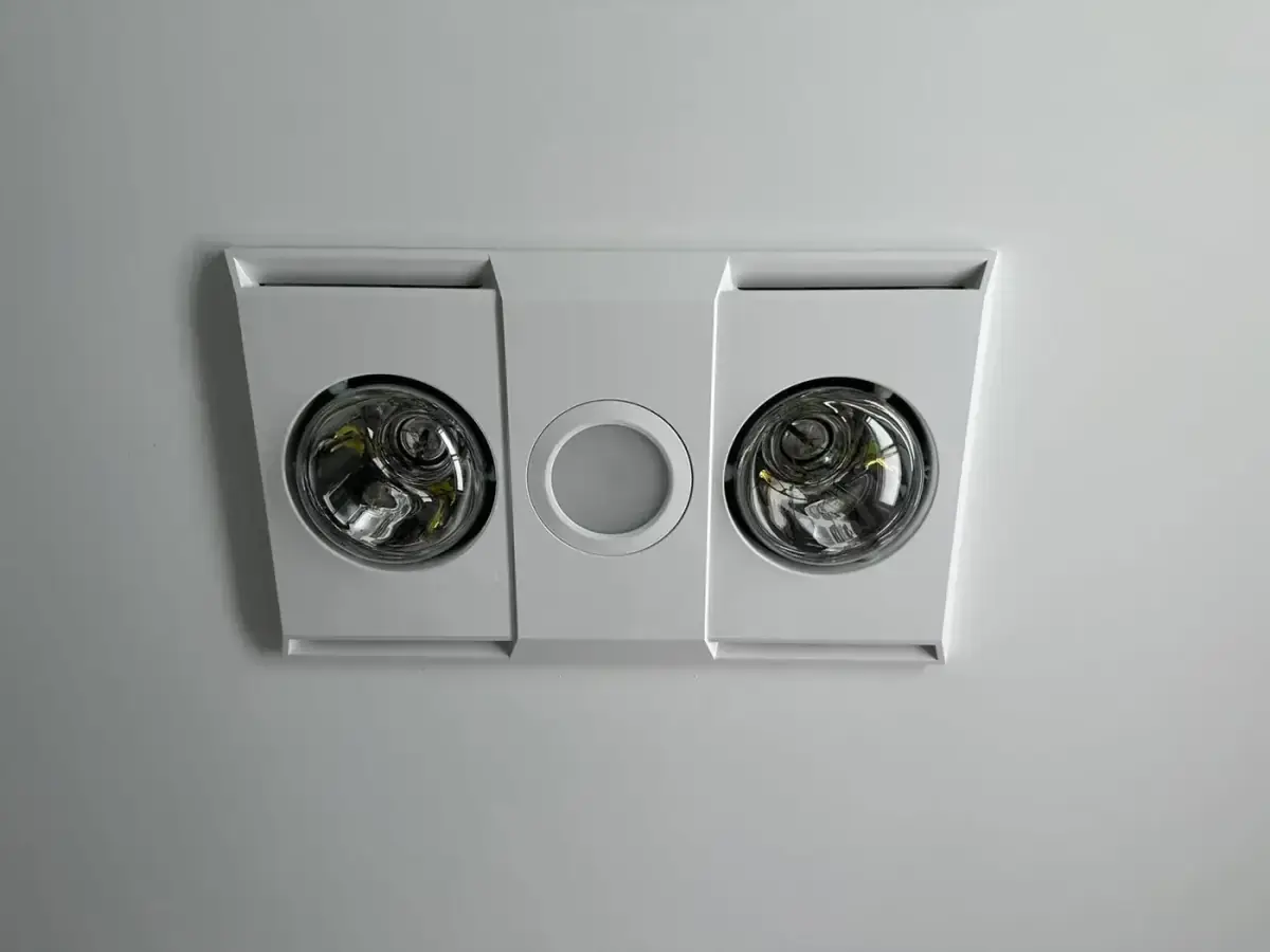 Close-up of a bathroom heat lamp, light and exhaust fan unit installed by Electrikell Qld