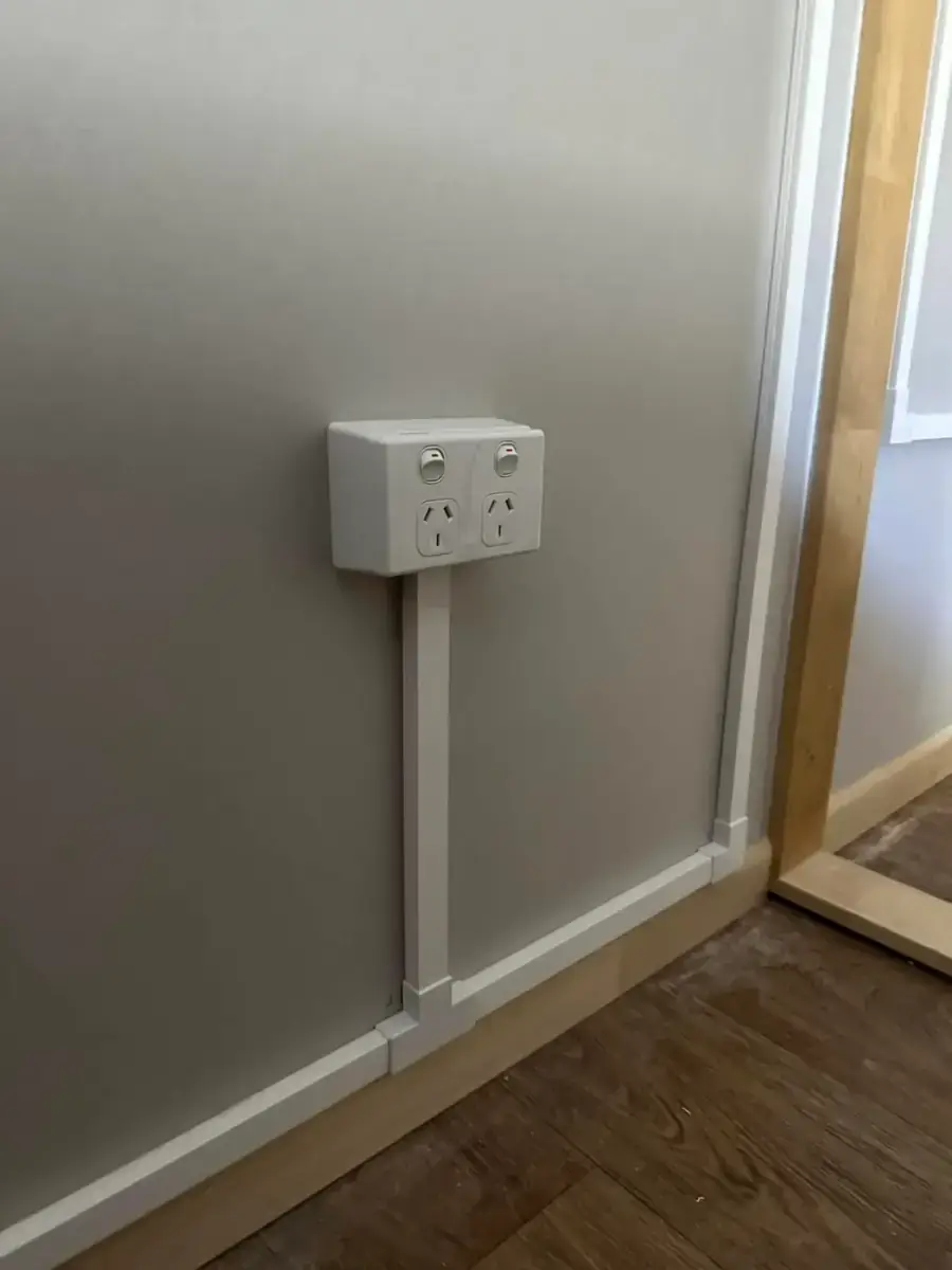 New double power point with surface conduit on a grey wall installed by Electrikell Qld in a Gladstone region home